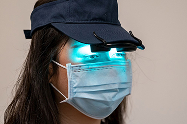 woman with face mask and lights on her eyes