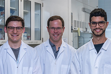 three doctors in lab coats