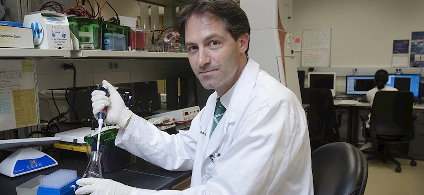 André Bachmann taking a sample from a vial