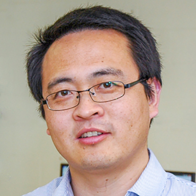 A headshot of Liangliang Sun wearing glasses and a blue button up
