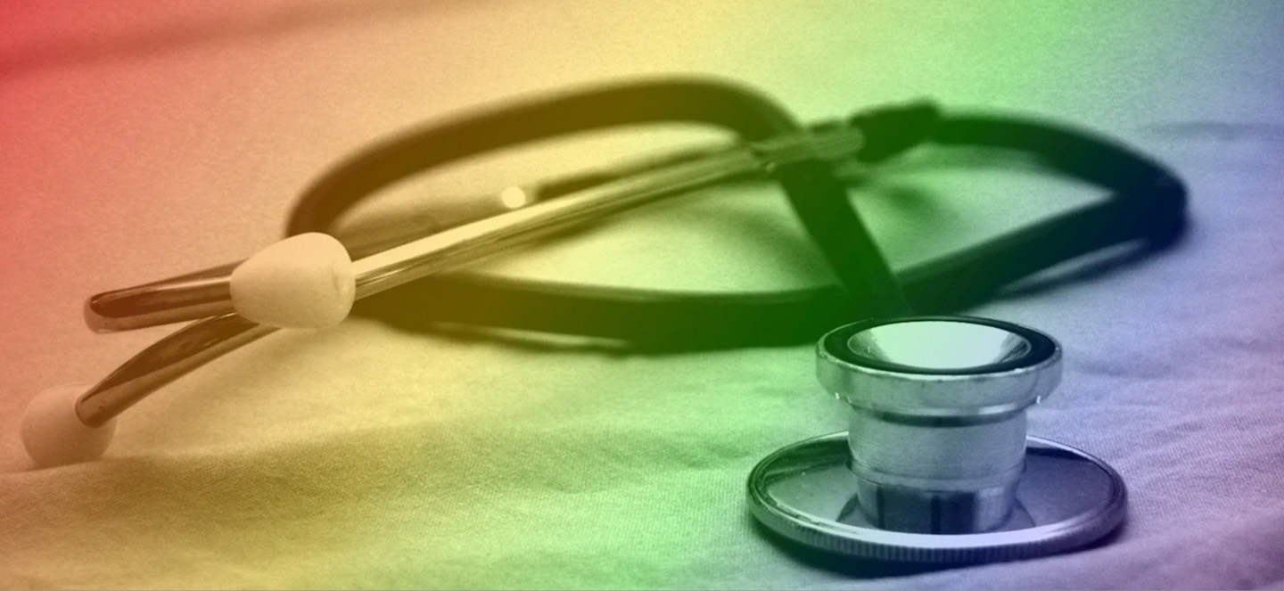A stethoscope on a table with a rainbow overlay