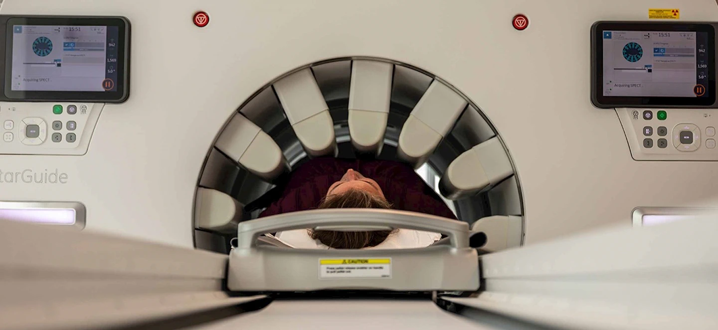 A human going through a PET scan
