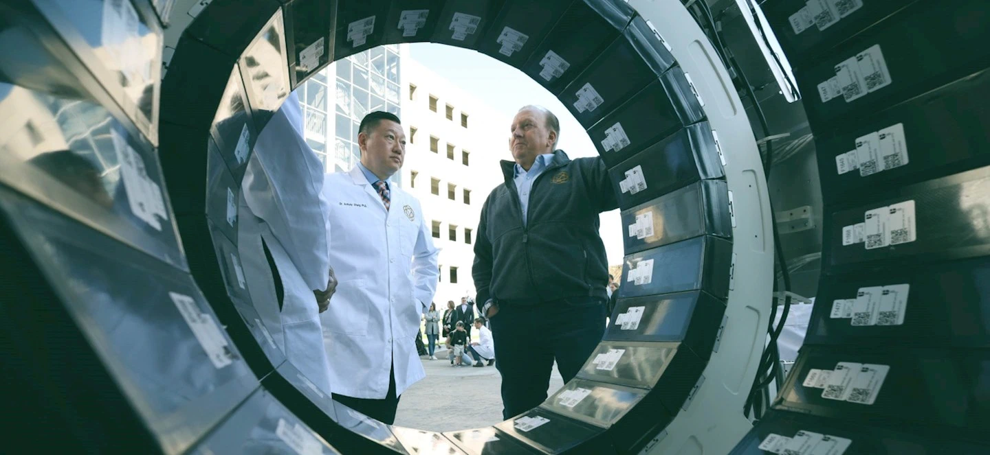 Mark DeLano and Anthony Chang near a PET/CT scanner