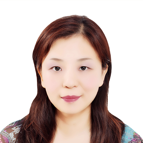 A headshot of Angela Chia-Chen Chen, hair down with white background. 