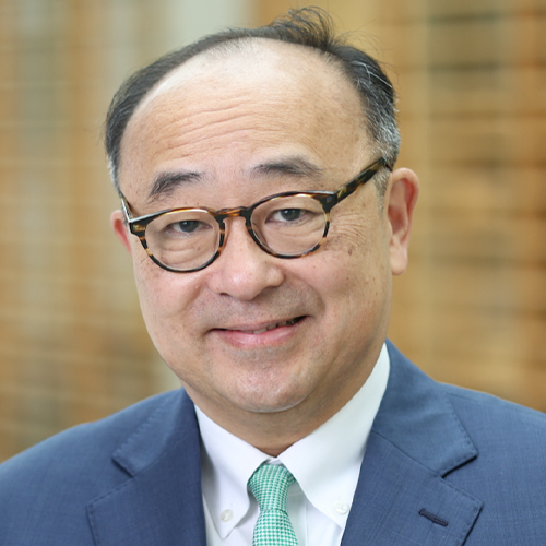 A headshot of Charles Hong, wearing glasses and blue suit jacket.